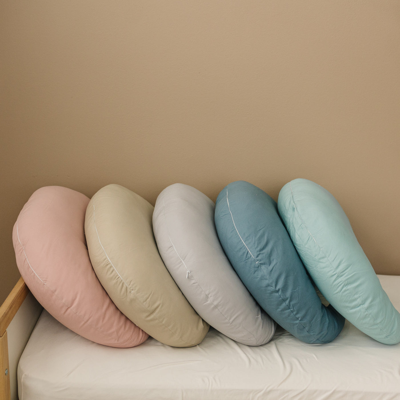 Crescent Nursing Pillow #color_stone #color_eucalyptus #color_bluejay #color_blush #color_fawn