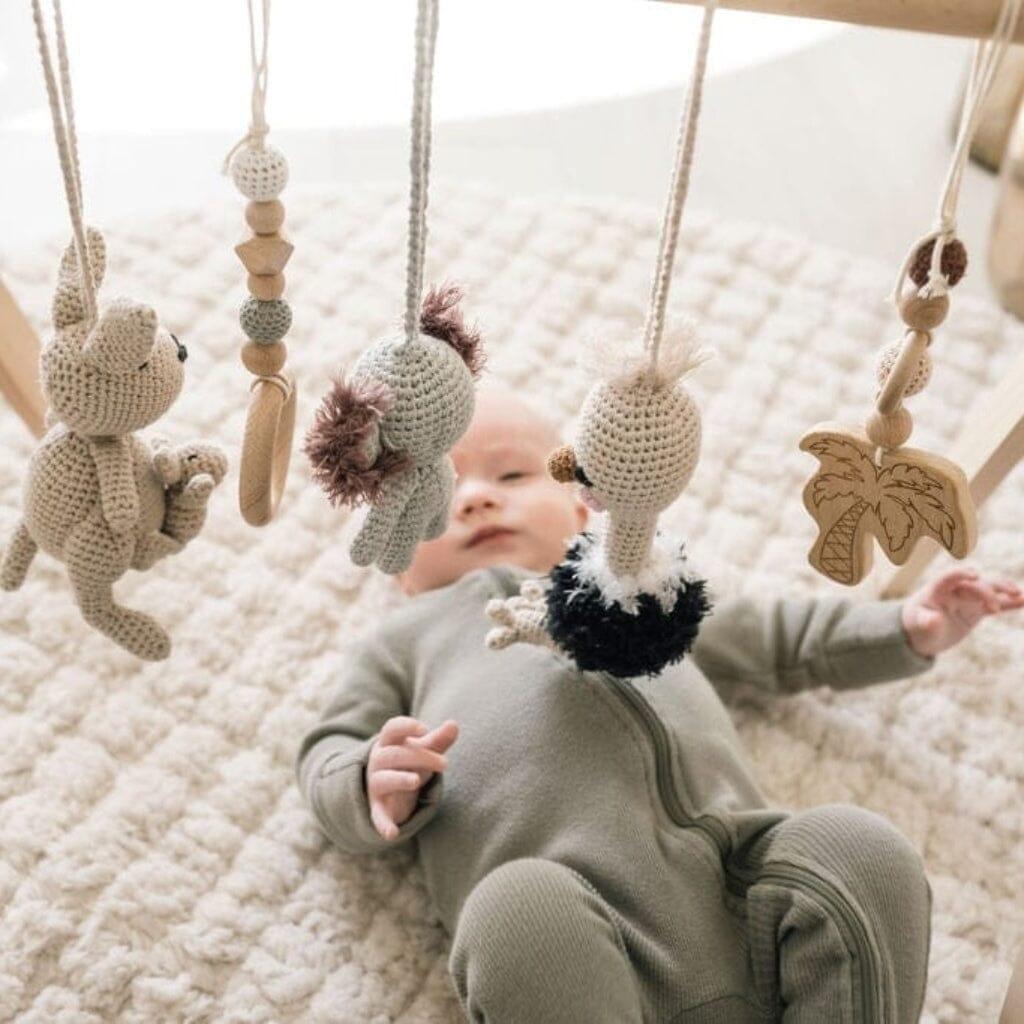 Jabaloo Australian Friends crochet toys hanging from a baby gym
